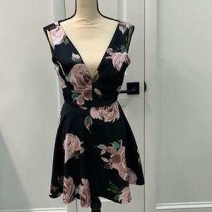Floral Dress. Ties in back. Open back. Elastic at waist. Size S.